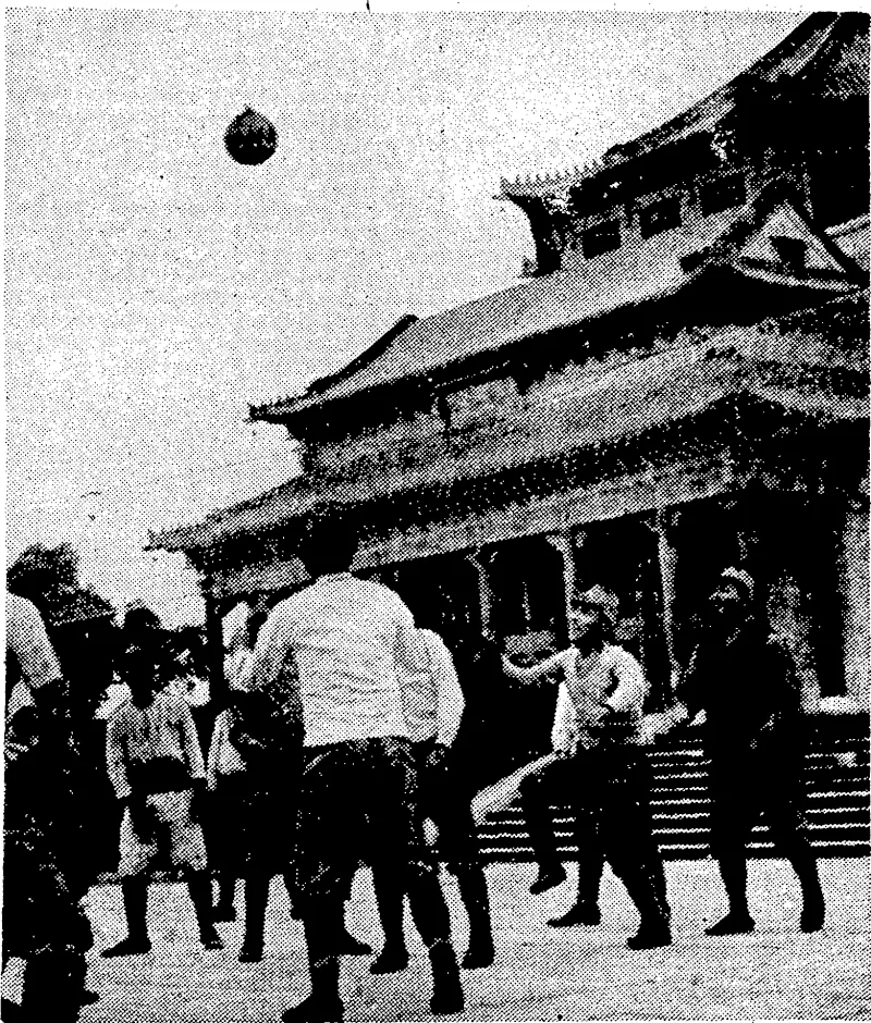 Japanese soldiers%take time off from tlie tedium of garrison duty to do some limbering up. Here they are seen playing volley* ball in the courtyard of the Chungshan Memorial Hall at Canton. (Evening Post, 20 July 1939)