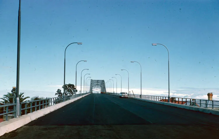 Car on Auckland Harbour Bridge shortly before the bridge was opened, 1959