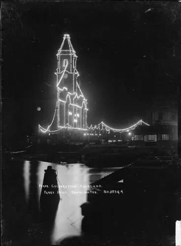 Image: View of Auckland Ferry Building taken at night to show the Peace celebration illuminations, 1918