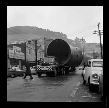 Image: Large pipe for Christchurch - Lyttelton Road Tunnel being transported through Lyttelton. Outside the Christchurch Star 20 Norwich Quay, Lyttelton July 1963.