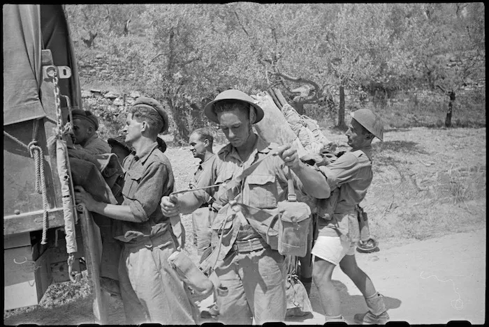 World War II New Zealand Infantry troops boarding truck for transport to rear after assault on Lignano, Italy - Photograph taken by George Kaye