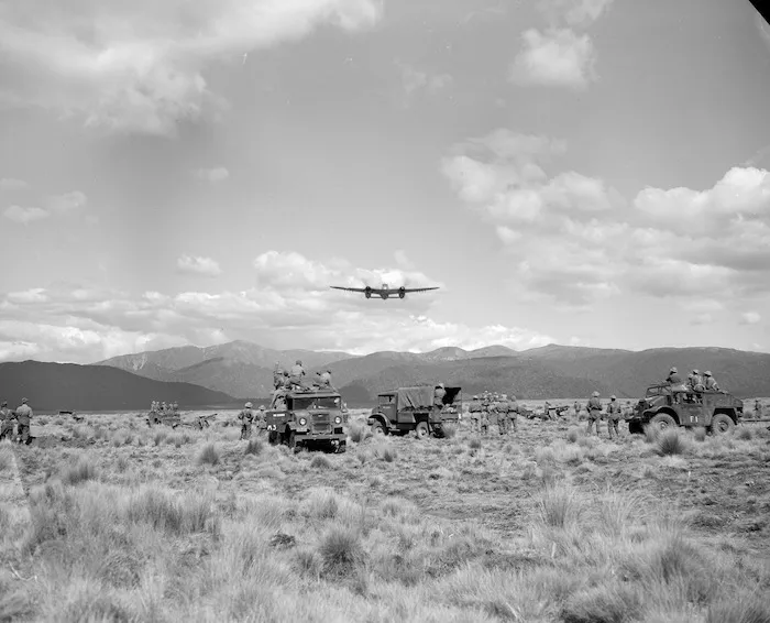 [Guns and transport under simulated attack by RNZAF Mosquito aircraft during final manoeuvres at Waiouru]