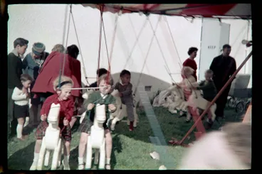 Image: Children riding on a carousel, 1964