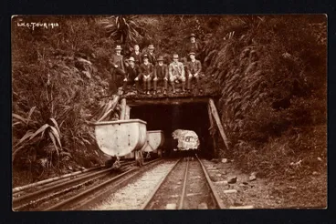 Image: Group of nine men above entrance to Otira Tunnel.