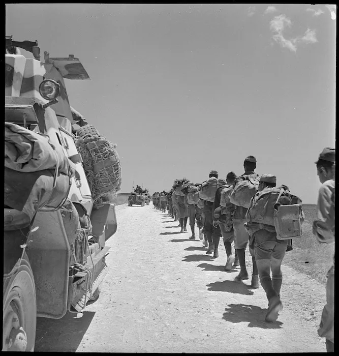 Armoured car passes Italian POWs marching back - Photograph taken by M D Elias