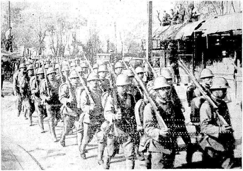 Sport and Ccneral" Photo. Japanese soldiers, part of a contingent comprising infantry, cavalry, artillery, anti-aircraft, and machinegun troops, which inarched through lire International Settlement at Shanghai on December 3, and ivas bombed by a Chinese student. He was shot in the pandemonium which ensued, when the Japanese threw a military^ cordon round_ the Settlement. (Evening Post, 11 January 1938)