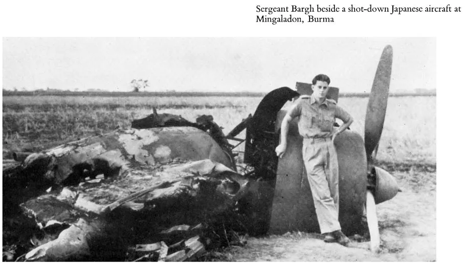 Sergeant Bargh beside a shot-down Japanese aircraft at Mingaladon, Burma