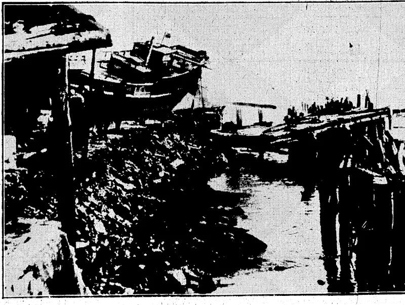 DEVASTATION BY EARTHQUAKE AND TIDAL WAVE.—The first pictures of the terfible Japanese earthquake and tidal wave, which was fallowed by fire, on March 3. Hundreds df pepfie were killed and thousands injured. The photograph ishows the seaside town of Kamaishi, in ihelwate Prefec-.^ lure, where considerable damage was done. (Evening Post, 02 May 1933)