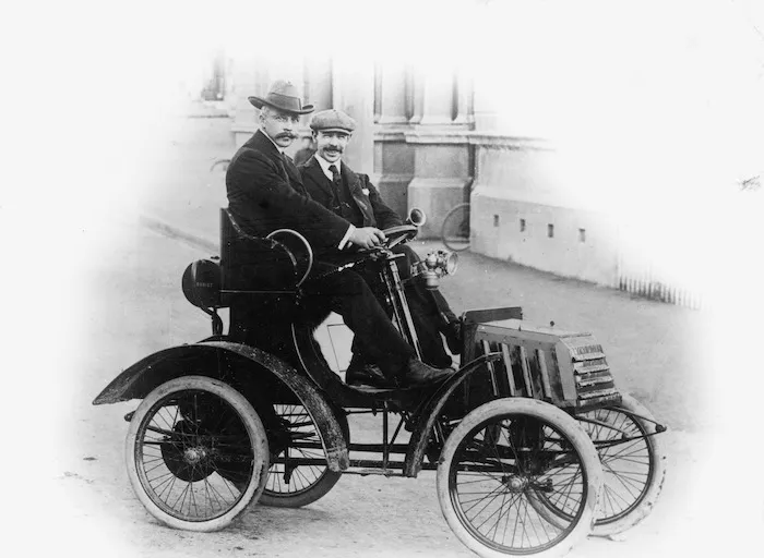 Men in an early motor car