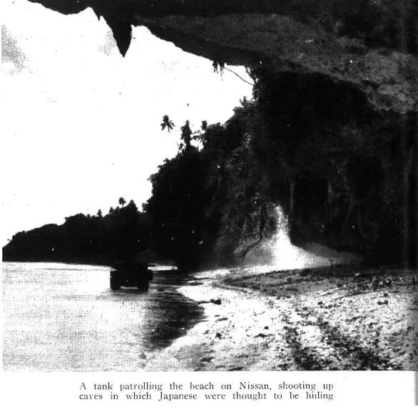 A tank patrolling the beach on Nissan, shooting up caves in which Japanese were thought to he hiding