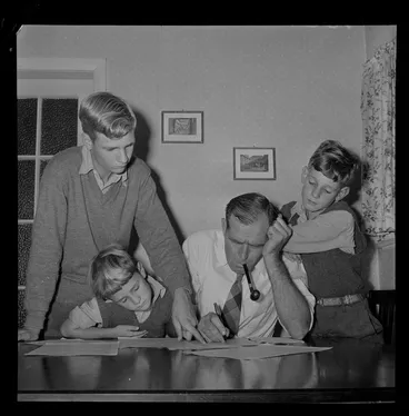 Image: Mr M A Watts with his sons filling in census forms