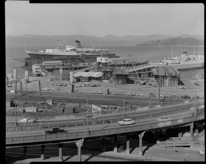 Hutt Road Thorndon Quay offramp, railway lines and ferry terminals with the Wahine and one other ferry at the wharf