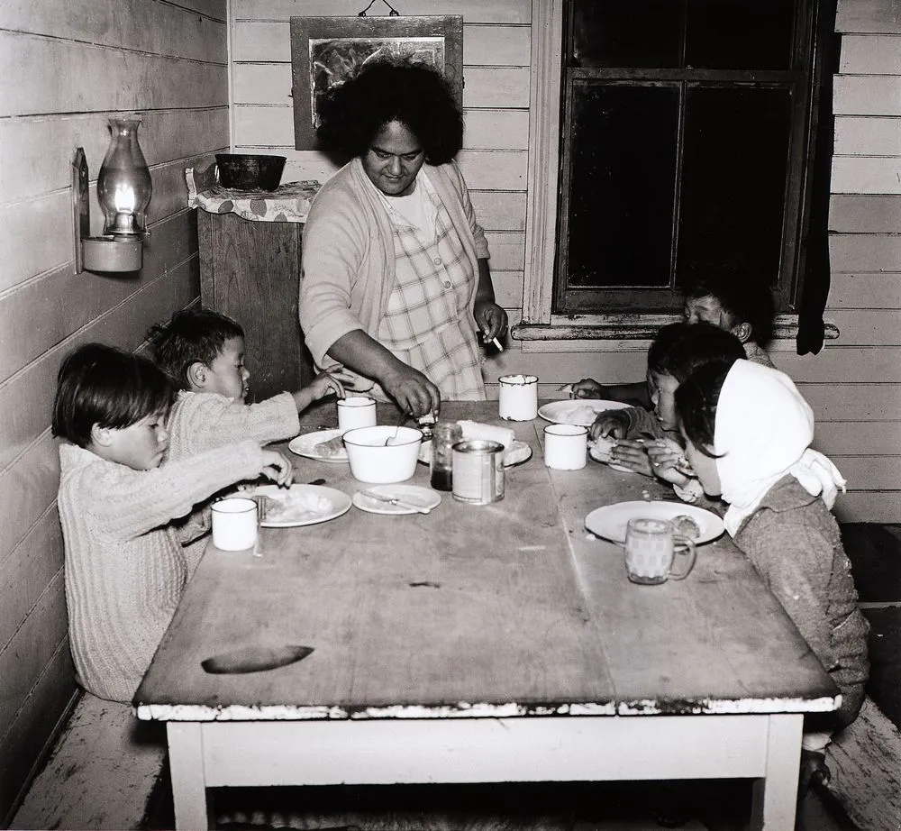 The children seat themselves around the table. From the series: Washday at the pa