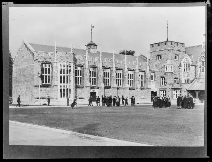 View of dining hall exterior and quadrangle, including members of staff wearing academic robes, Christ's College, Christchurch