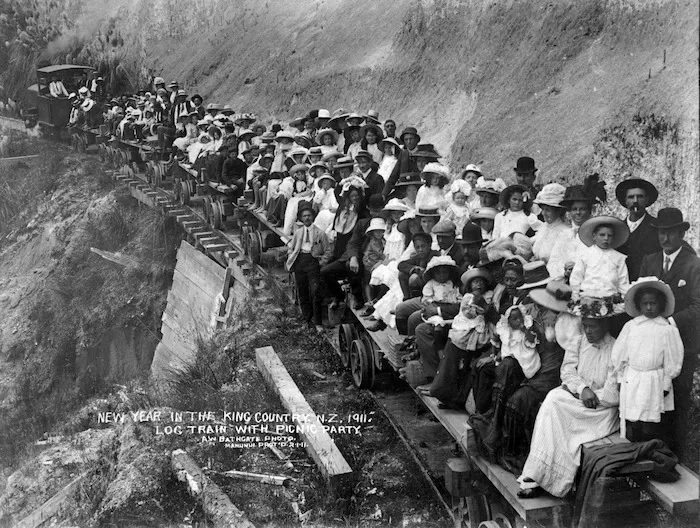 New Year's picnic party riding on a log train at Manunui