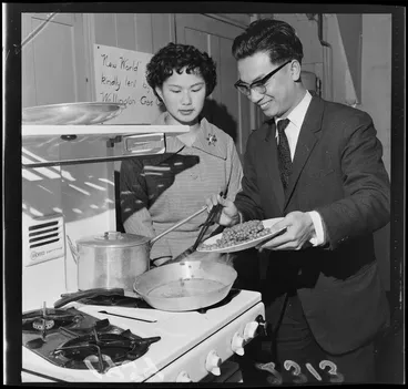 Image: Mr Li and Miss F Wong Shee demonstrating Chinese cookery on a gas stove at the Wellington YMCA