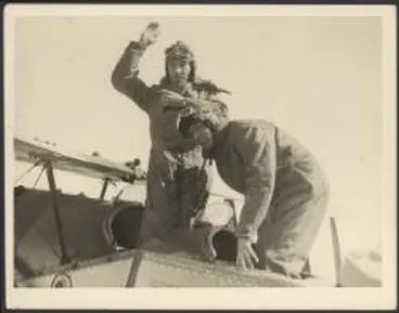 Image: Charles Kingsford Smith and Charles Ulm, before alighting from cockpit of Bristol Tourer biplane on arrival at Auckland, New Zealand, September 1928 / Weekly News