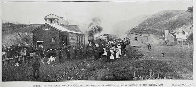 PROGRESS OF THE NORTH AUCKLAND RAILWAY: THE FIRST TRAIN ARRIVING AT WAYBY STATION, ON THE KAIPARA LINE