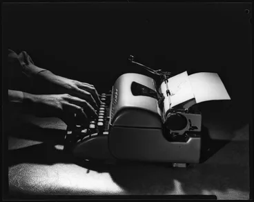 Image: Hands typing; inscribed 'Storey'