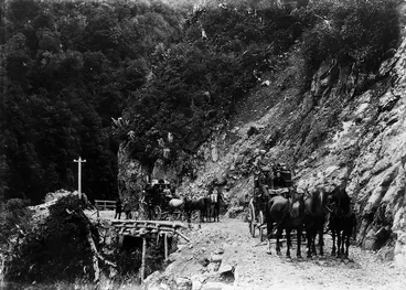 Image: Two horse drawn coaches travelling through the Otira Gorge