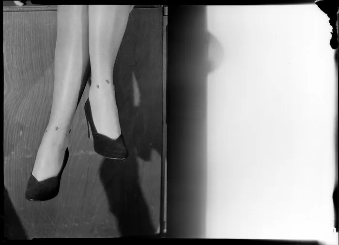 Feet modelling high heeled shoes & jewelled stockings