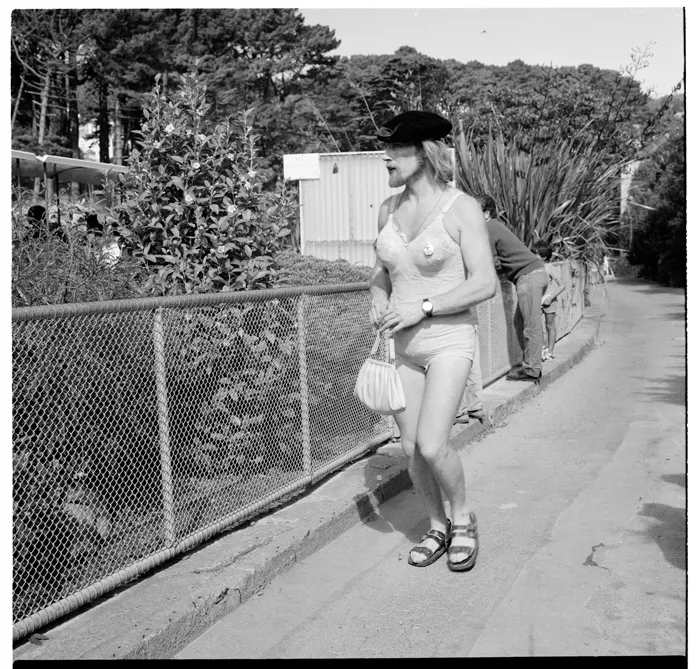 Parade of people in fancy dress, and spectators, through Newtown, Wellington