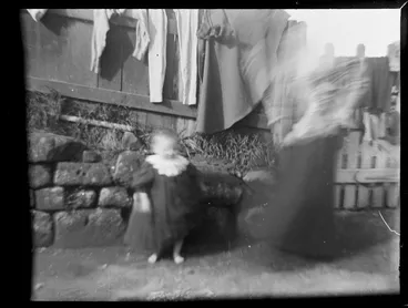 Image: Child and woman in backyard