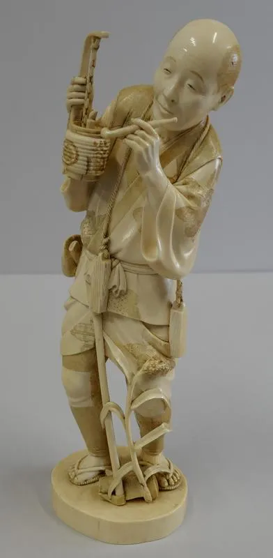 Okimono: Hino yojin no oyaji [Fire Watchman]; Man holding a lantern and a pipe