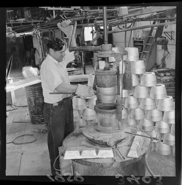 Image: Unidentified man processing pots, at a Lower Hutt factory, Wellington