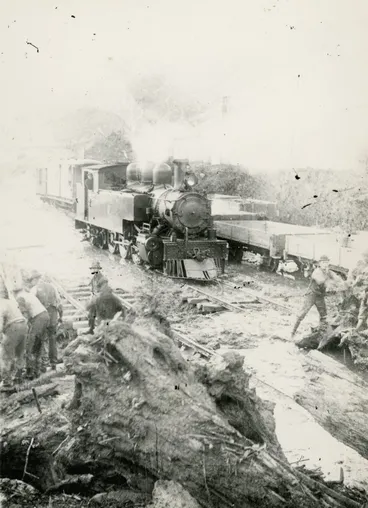 Image: Summit station yard; clearing debris from the tracks. Five men visible.